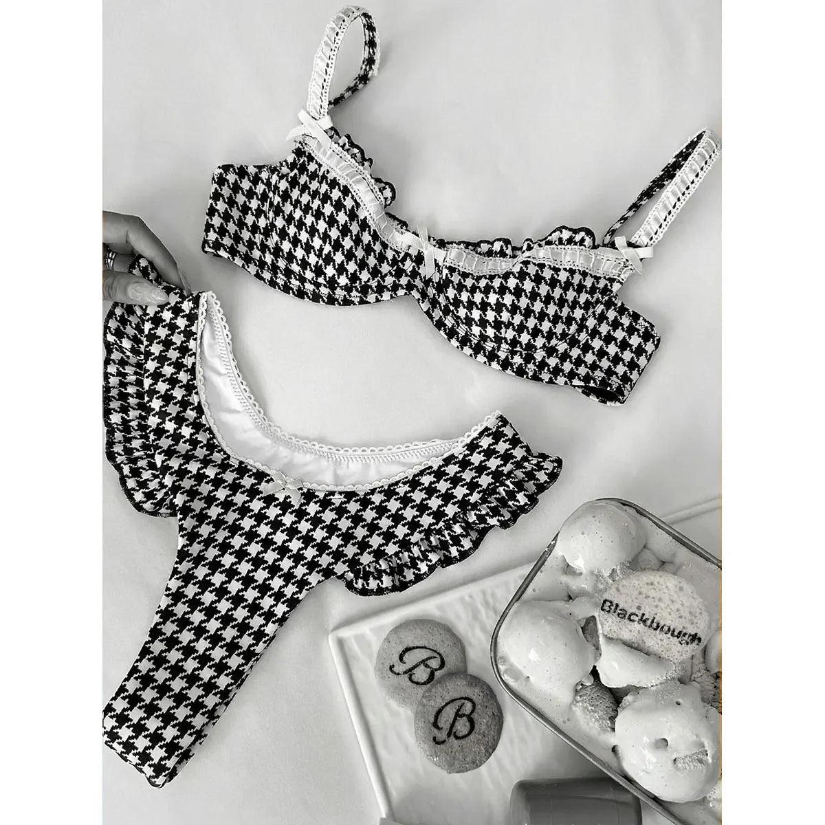 Black and white houndstooth lingerie set with lace trim, styled with cookies and ice cream