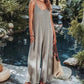 Woman in striped sleeveless jumpsuit by poolside, summer fashion outfit with woven bag
