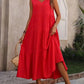 Red sleeveless tiered maxi dress with V-neck, perfect for summer fashion and beach outings