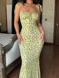 Yellow floral midi dress with tie straps, perfect for women's fashion and summer style