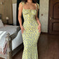 Yellow floral midi dress with tie straps, perfect for women's fashion and summer style