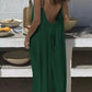 Woman in green backless maxi dress, summer fashion, outdoor dining setting
