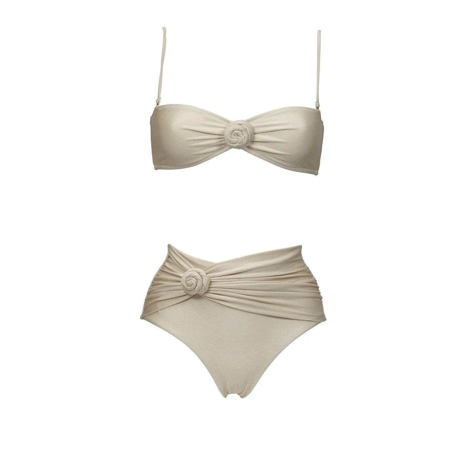 Beige two-piece bikini with floral knot detail, high-waisted bottoms, and spaghetti straps for women's fashion.