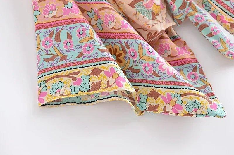 Floral print women's fashion dress with vibrant pastel patterns and boho detailing