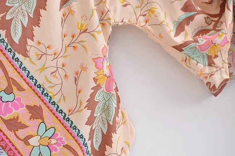 Floral print women's fashion top with vibrant botanical pattern and decorative trim