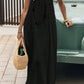 Woman in black spaghetti strap maxi dress with straw bag, summer fashion outfit