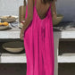 Woman in vibrant pink backless maxi dress, summer fashion, outdoor dining setting