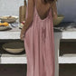 Woman in pink backless maxi dress, summer fashion, outdoor dining setting
