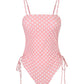 Pink polka dot one-piece swimsuit with side ties and thin straps for women's beach fashion