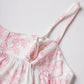 White floral print camisole with pink rose pattern and adjustable straps, women's fashion top