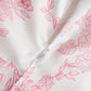 White dress with pink floral print and zipper detail, women's fashion