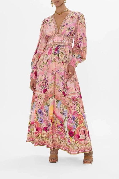 Pink floral maxi dress with long sleeves, V-neck, and gold trim for women's fashion