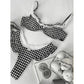 Black and white houndstooth lingerie set with lace trim, styled with cookies and ice cream