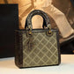 Elegant women's handbag with quilted design, gold hardware, and textured handles for luxury fashion