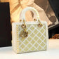 Elegant white and gold crystal-embellished handbag with quilted design, perfect for women's fashion