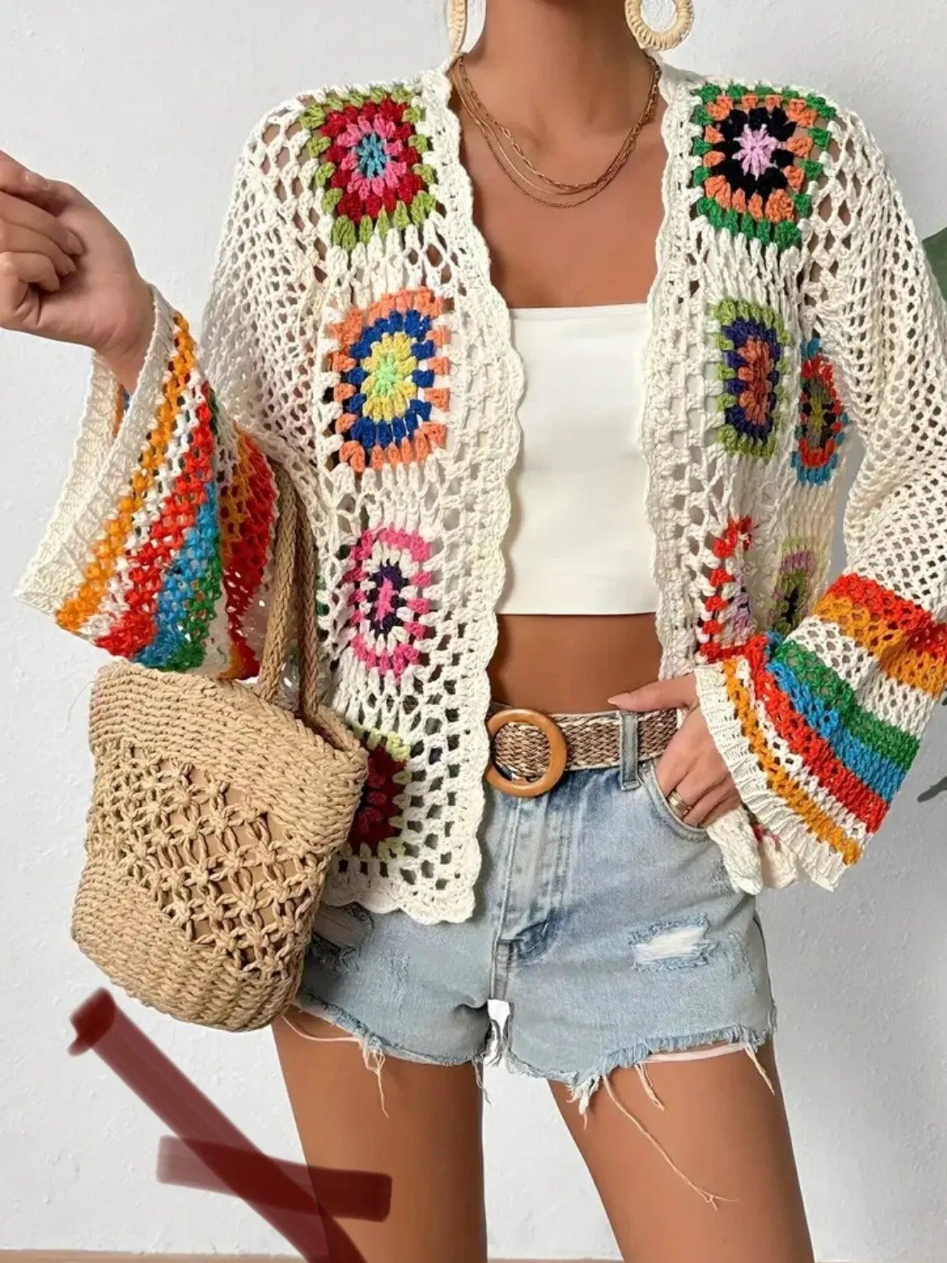 Colorful crochet cardigan with floral granny squares, boho summer outfit, denim shorts, woven bag