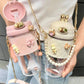 Cute pastel water bottles with pearl straps, bunny ears, and bow charms for women's fashion