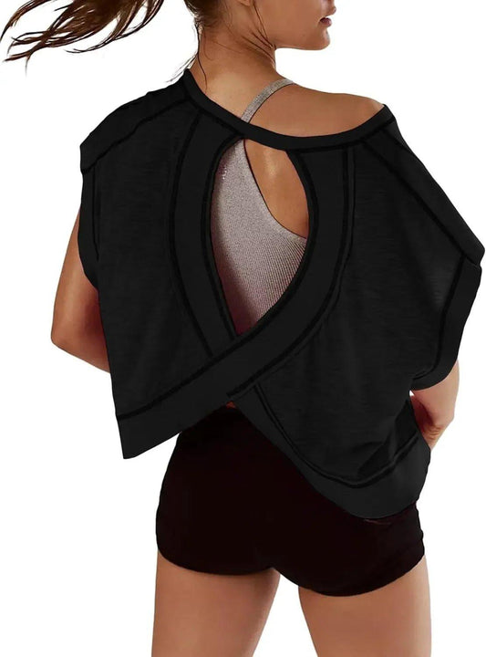 Black open-back workout top with crisscross design, paired with gym shorts for women's fitness fashion