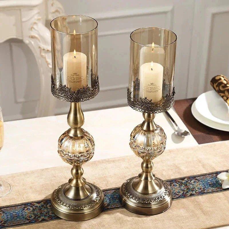 Elegant brass candle holders with glass shades, perfect for home decor and romantic table settings