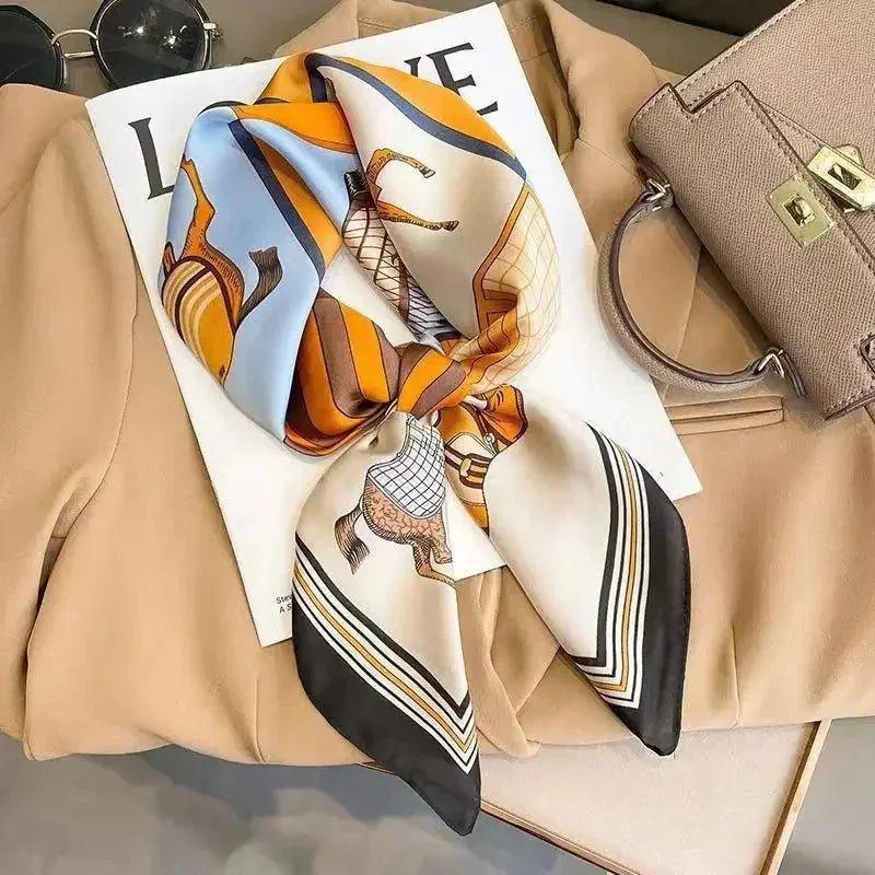 Stylish horse-print silk scarf with striped edges, perfect for women's fashion and accessorizing outfits.