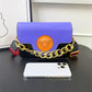 Purple and black designer handbag with gold chain strap and Medusa emblem, luxury women's fashion accessory
