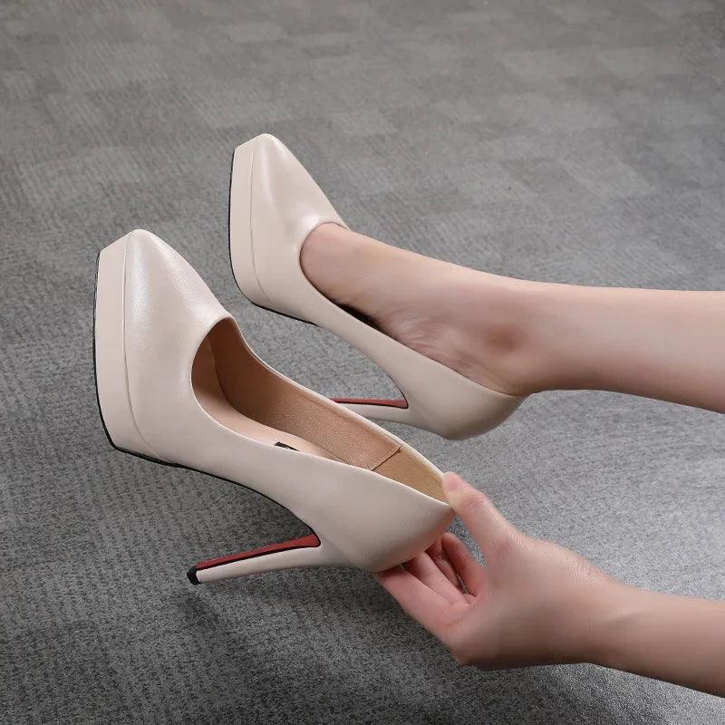 Beige women's high heels with pointed toe and red sole, perfect for fashion and elegance