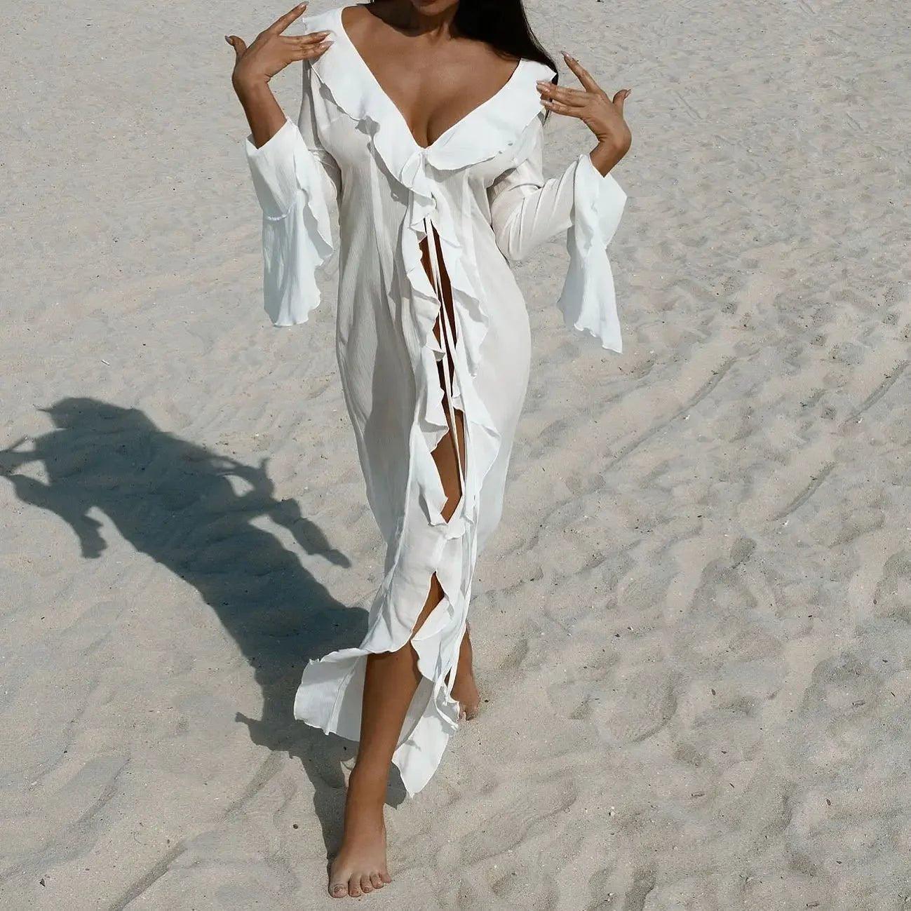 White ruffled beach cover-up dress with deep V-neck and side slits, perfect for summer fashion