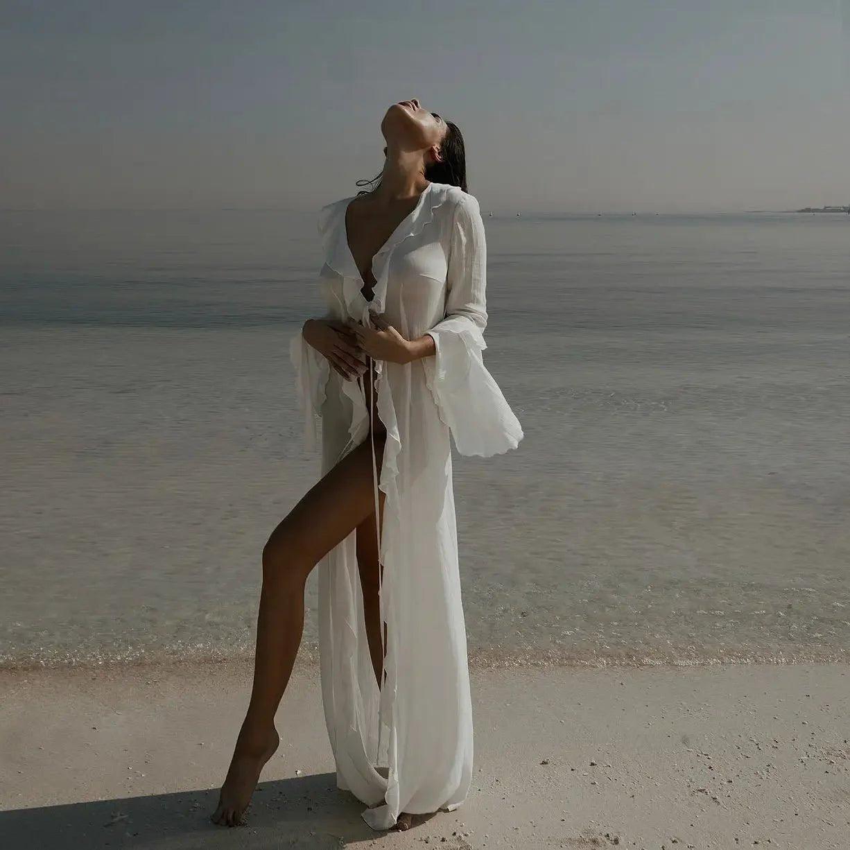 Woman in white beach cover-up at ocean shore, stylish summer fashion