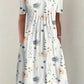 White floral print women's dress with short sleeves and round neckline, perfect for spring fashion