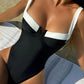Black and white one-piece swimsuit with plunging neckline, beach fashion