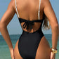 Black one-piece swimsuit with white straps and back tie, beach fashion for women