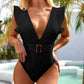 Black one-piece swimsuit with ruffle shoulders and tortoiseshell belt, poolside fashion
