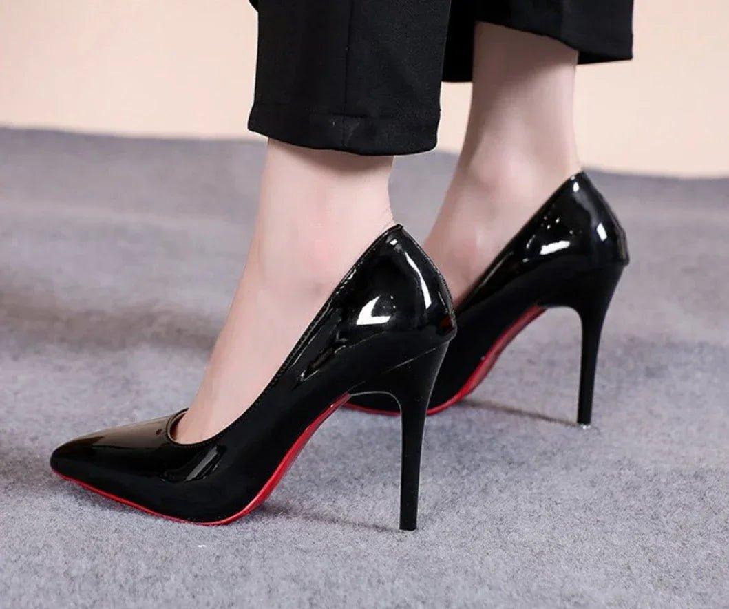 Black patent leather stiletto heels with red soles, women's fashion footwear