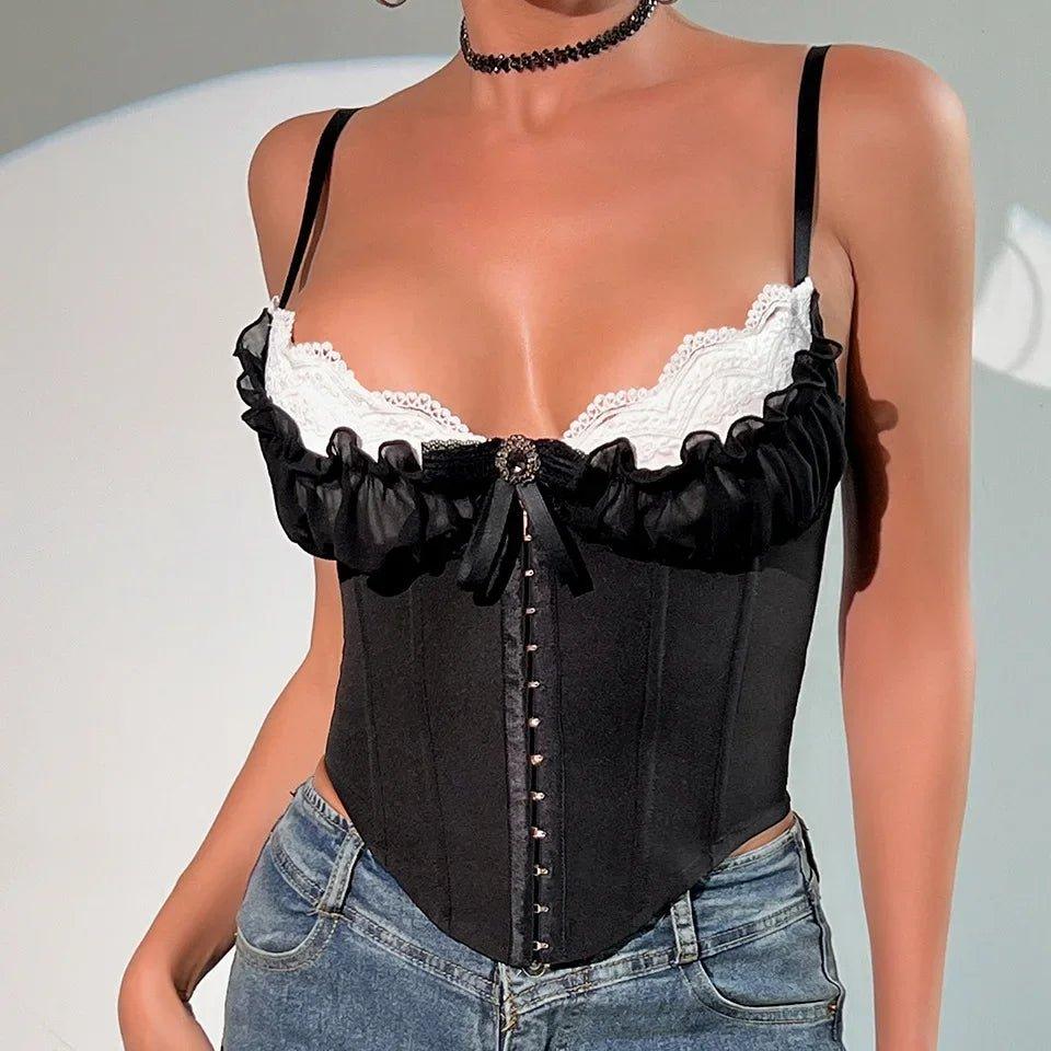 Black lace-up corset top with white lace trim and ruffles, paired with jeans for women's fashion