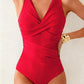 Red one-piece swimsuit with plunging V-neck and ruched wrap design, perfect for beach fashion