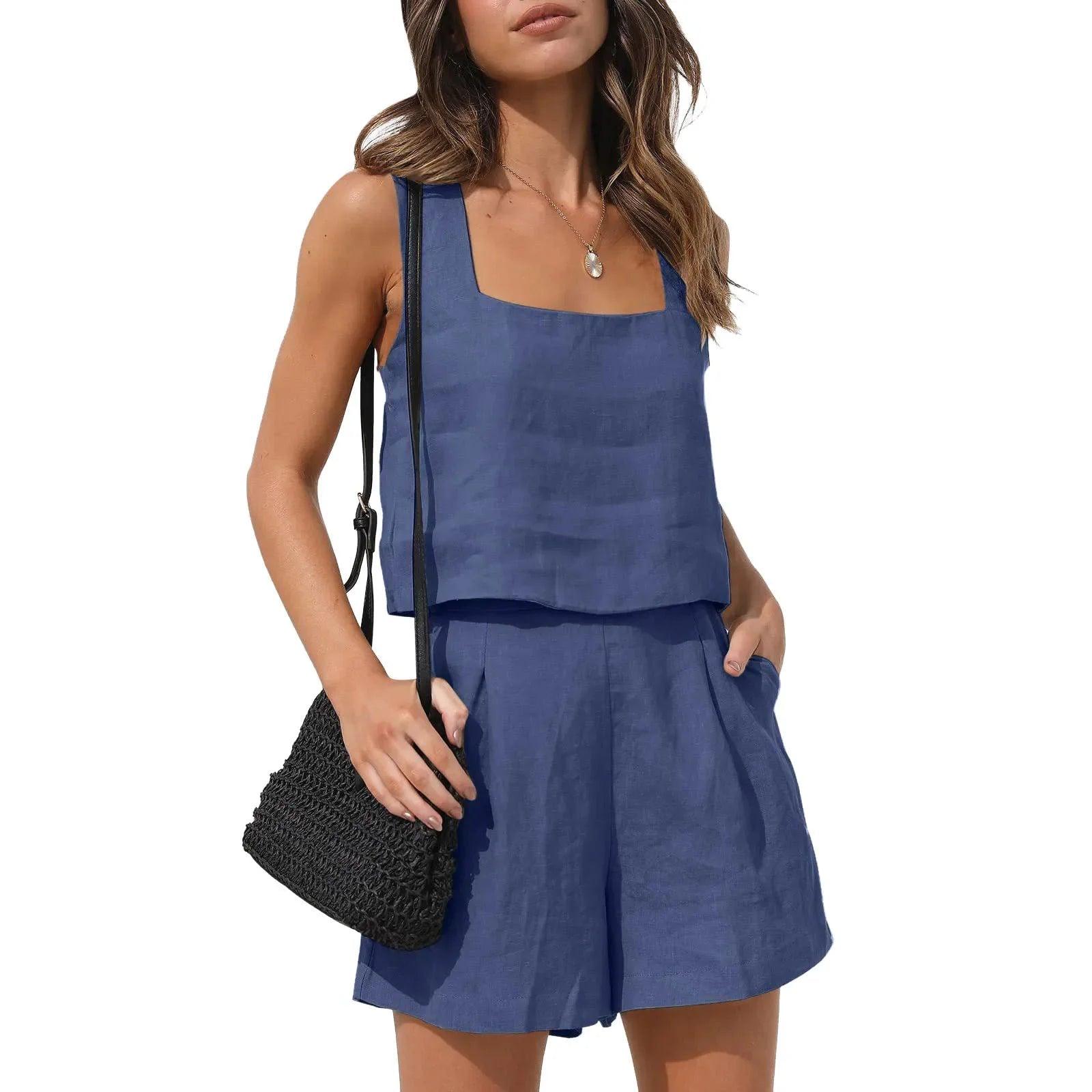 Blue linen women's sleeveless top and shorts set with square neckline, paired with black woven bag