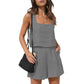 Gray women's sleeveless top and shorts set with square neckline, paired with black woven bag