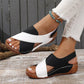 Women's black and white wedge sandals with crisscross straps, perfect for summer fashion