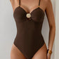 Brown one-piece swimsuit with gold shell detail and adjustable straps, women's beach fashion