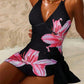 Black floral one-piece swimsuit with pink lily print, beach fashion for women