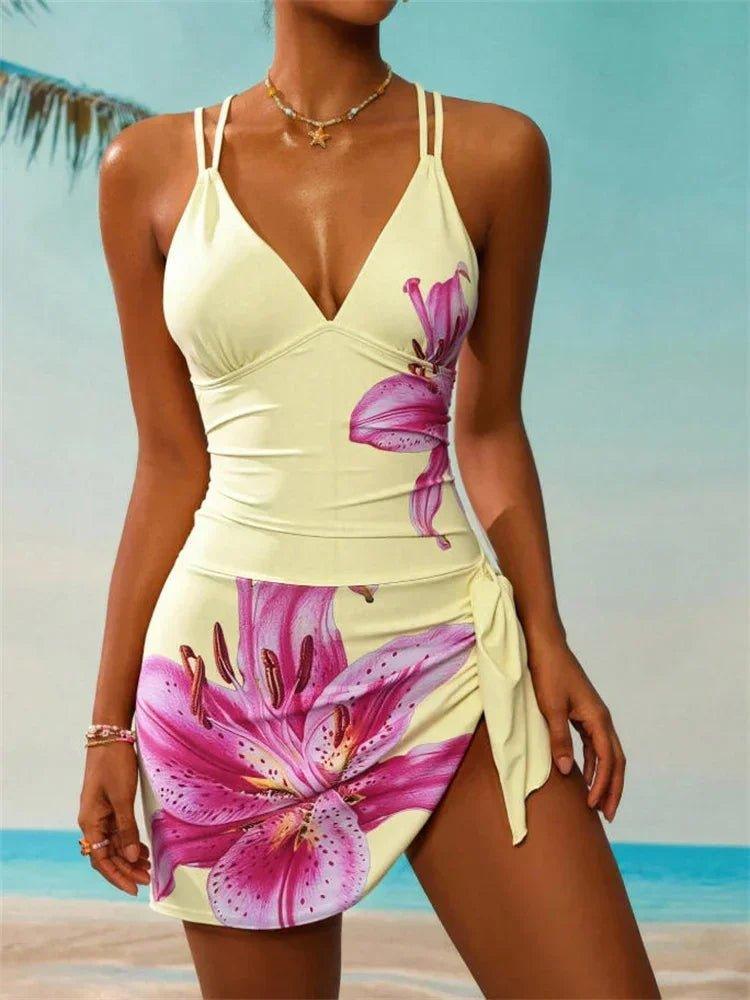 Women's floral print beach dress with pink lily design, perfect for summer fashion and beachwear.