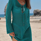 Teal crochet beach cover-up dress with long sleeves and V-neck, perfect for summer fashion