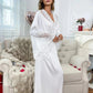 White lace-trimmed satin robe for women, elegant sleepwear in cozy bedroom setting