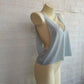 Light blue women's backless crop top on mannequin, stylish summer fashion
