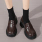 Brown platform loafers with black socks, stylish women's fashion shoes