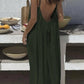 Woman in olive green backless maxi dress, summer fashion, outdoor dining setting