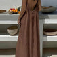 Woman in backless brown maxi dress, summer fashion, beach style, elegant flowy dress