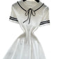 White ribbed knit dress with black trim, sailor collar, and bow tie for women's fashion