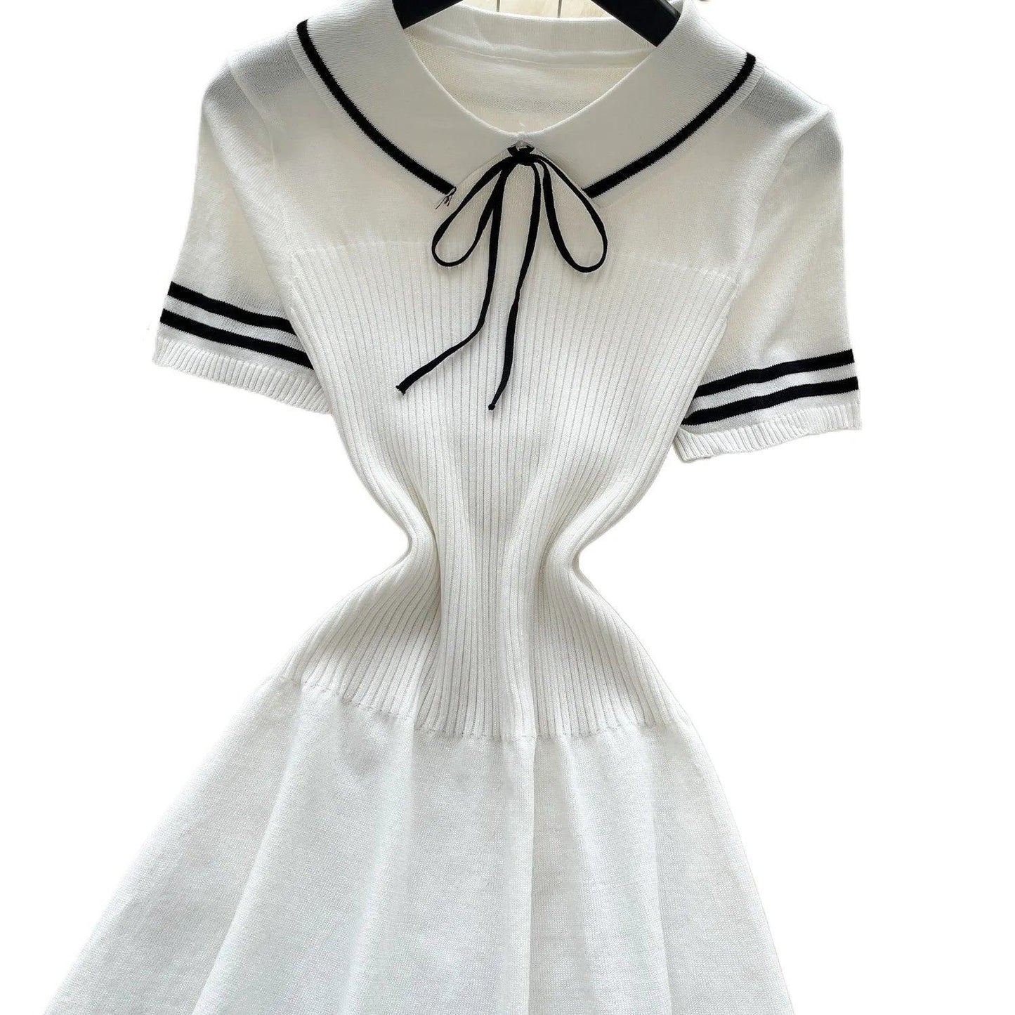 White ribbed knit dress with black trim, sailor collar, and bow tie for women's fashion